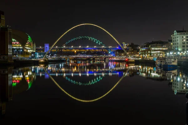 The illuminated bridges over the river Tyne at night in Newcastle, England