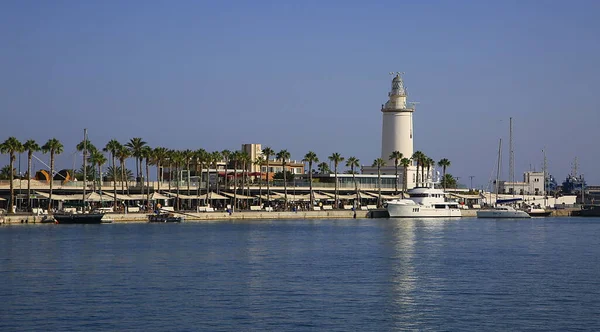 the lighthouse on the pier at Malaga Port, Spain