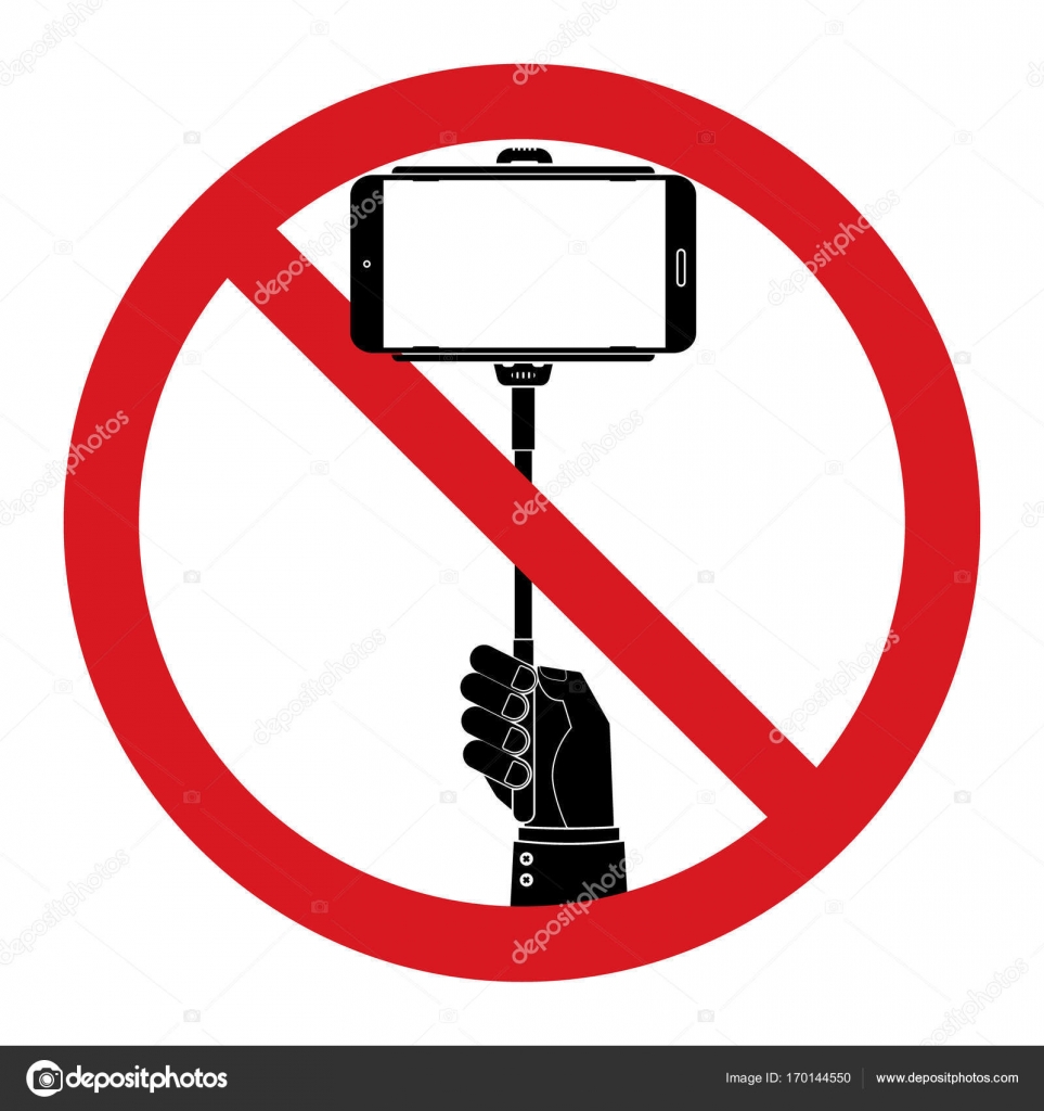 Human hand hold selfie sticks with No selfie sticks prohibit sign