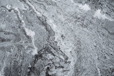 Blurry abstract of grey marble stone wall texture background.