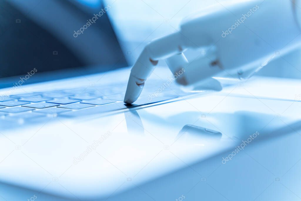 Robot hand pointing to laptop buttons, web technology and machine learning concept.