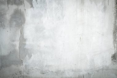 Abstract dirty cement wall texture background with cracks and copy space.