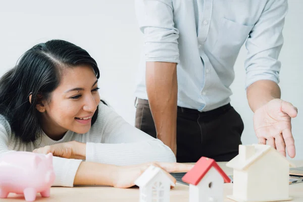 The best choice of house.House owner and architect discussing a choice.Couple dreaming of new home.