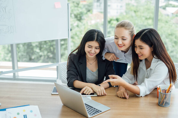 Business people having fun and chatting at workplace office. Happy business colleagues in modern office
.