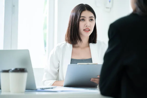 Ideas of job interview concept.Beautiful asian business woman job interview with manager business.Smart Asian staff woman meeting with asian investor and coworker discuss office background.