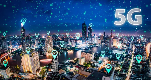 Abstract digital 5G network over urban city background.