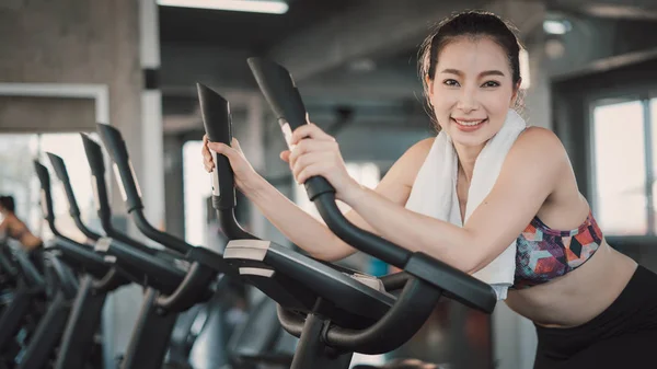 Young Asian Woman Exercising Bicycle Fitness Center — 图库照片