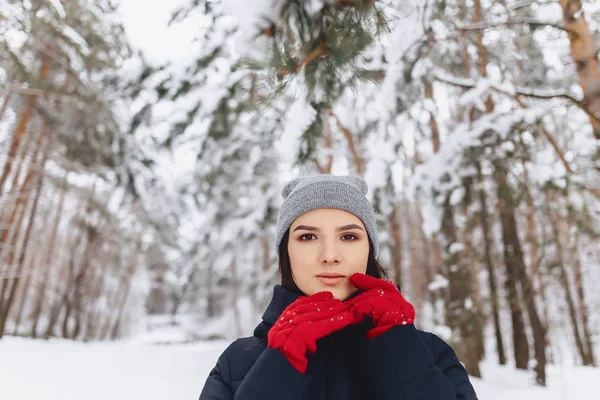 A large portrait of a girl in red gloves with expressive eyes in — Stock Photo, Image