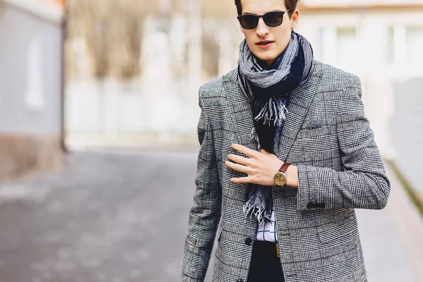 Stylish boy in sunglasses in coat with briefcase on street — Stock Photo, Image