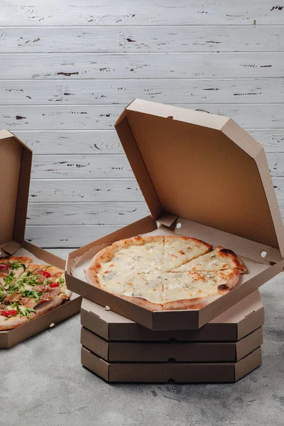 delicious pizza in packs, concept of food delivery