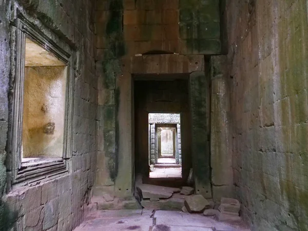 Demolished stone rock door frame at Preah Khan temple Angkor Wat