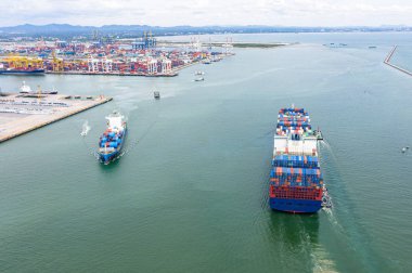  top aerial view of the TEU containers ship arrival and departure the port, carriage the shipment from loading port to destination discharging port, transport and logistics services to worldwide 