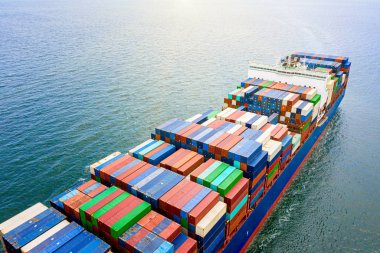 the large TEU container ship sailing in the sea carriage the shipment cargo from loading port to destination discharging port, transport and logistcs system services to worldwide 