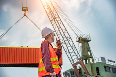 engineering, foreman, supervisor, worker, loading master in work site, control to the teamwork by walkie talkie radio for job done in the same direction, working at risk and high level of insurance