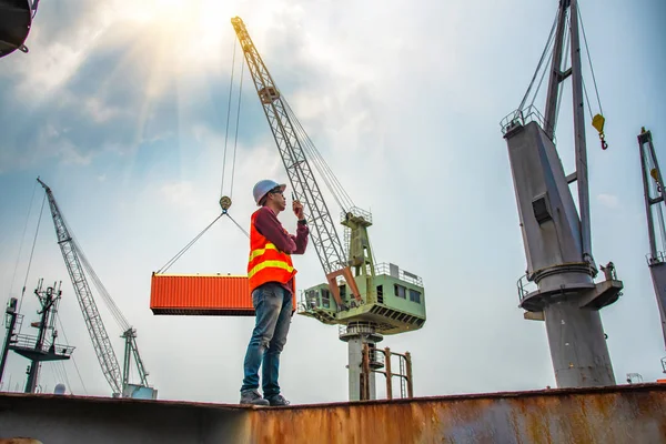 engineering, foreman, supervisor, worker, loading master in work site, control to the teamwork by walkie talkie radio for job done in the same direction, working at risk and high level of insurance