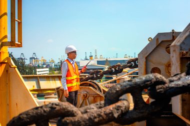 motorman or ship crew on duty of prepare the ship in drop anchorage the ship in port for safety, security berthing in port under command of the master or captain and port control