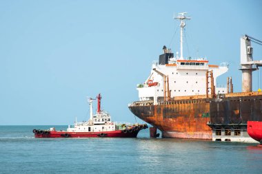 the ship under navigating by pilot and port control to berth in the floating dock, assist by tugs boat for safety to the gate of docking, recondition, repair, cleaning overhull of ship in dry doc