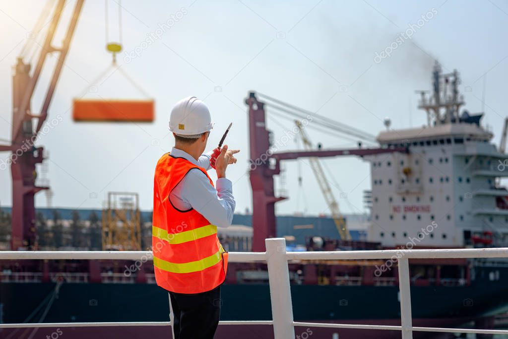 stevedore, loading master, port captain or supervisor in charge of command working on board the ship in port for safety loading discharging operation