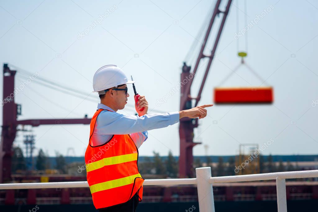 stevedore, loading master, port captain or supervisor in charge of command working on board the ship in port for safety loading discharging operation