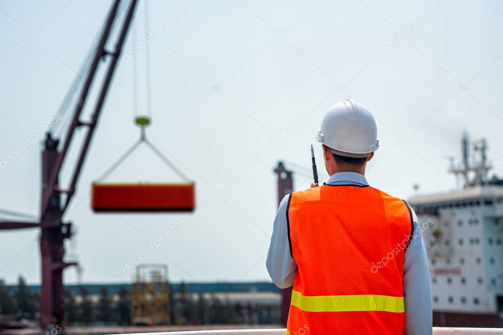 stevedore, loading master, port captain or supervisor in charge of command working on board the ship in port for safety loading discharging operatio