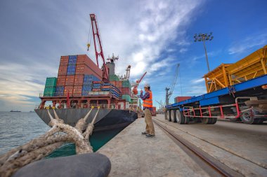 the loading and discharging operation container ship vessel in port takes control by stevedore and foreman in charge, working in port terminal being for logistics and transport services to worldwid