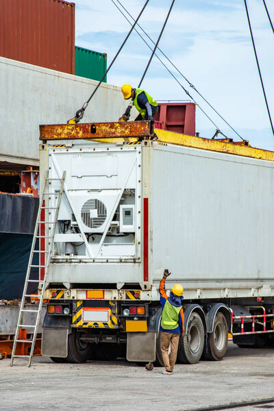 the loading, discharging operation on container ship vessel in port takes control by stevedore and labor, foreman, working in port terminal being for logistics and transport services to worldwide