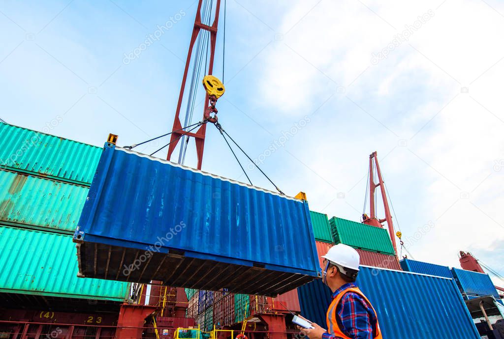 Container unit being lift handle by the ship crane from the transport trailer delivery to the port, service of logistics and transport shipment to Worldwide global