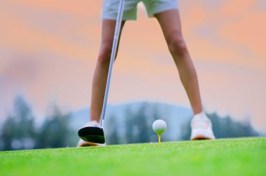 wood driver being backswing ready to hit golf ball away to destination on the fairway for best winning score