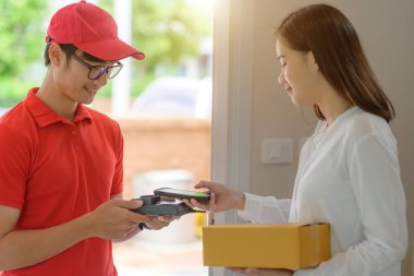 delivery boy in charge of sending or pick up packages parcel to or from customer, device signed scanner barcode accepted report online to completed parcel delivered in hand clipart