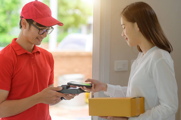 delivery boy in charge of sending or pick up packages parcel to or from customer, device signed scanner barcode accepted report online to completed parcel delivered in hand