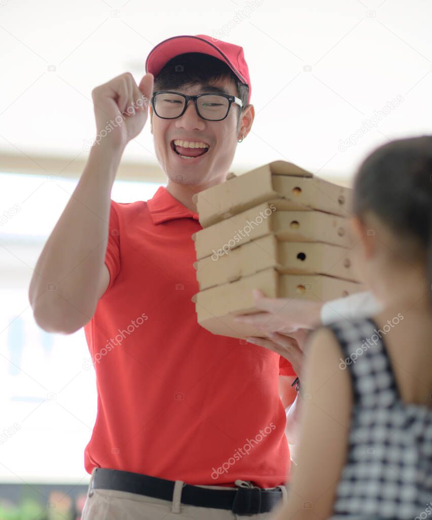 pizza delivery man in time delivery and hand over to the customer in fresh and hot condition, speed and swift service ordering