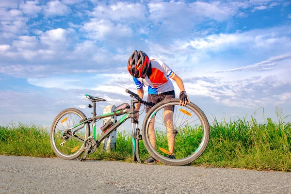 Woman Bicycle Cyclist Trouble Front Tire Wheel Needs Repair Adjusting Royalty Free Stock Photos