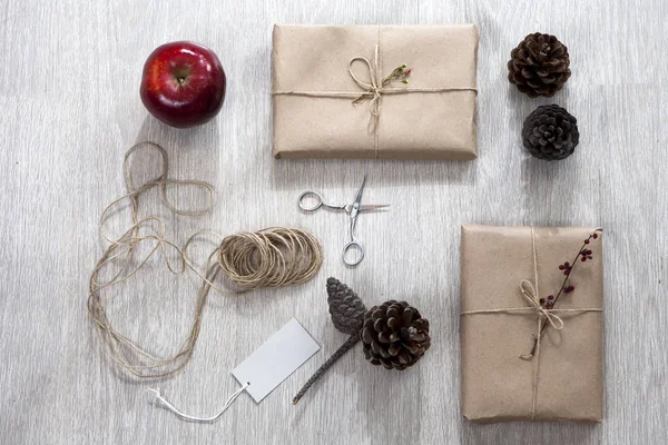 Various items for gift wrapping are on the table.