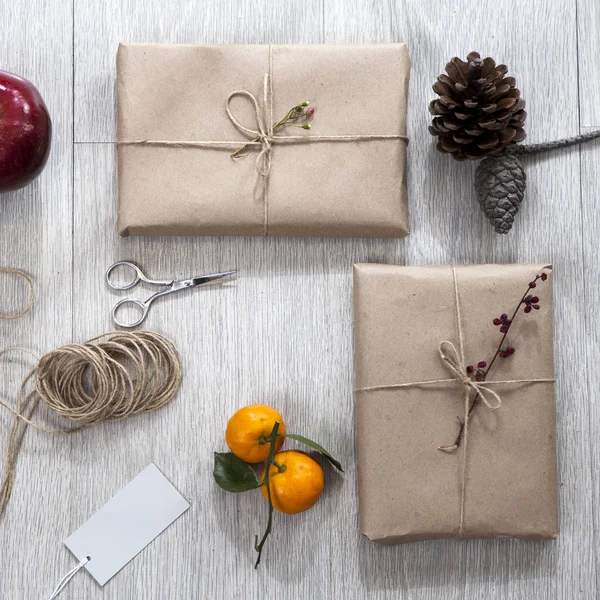 Various items for gift wrapping are on the table.