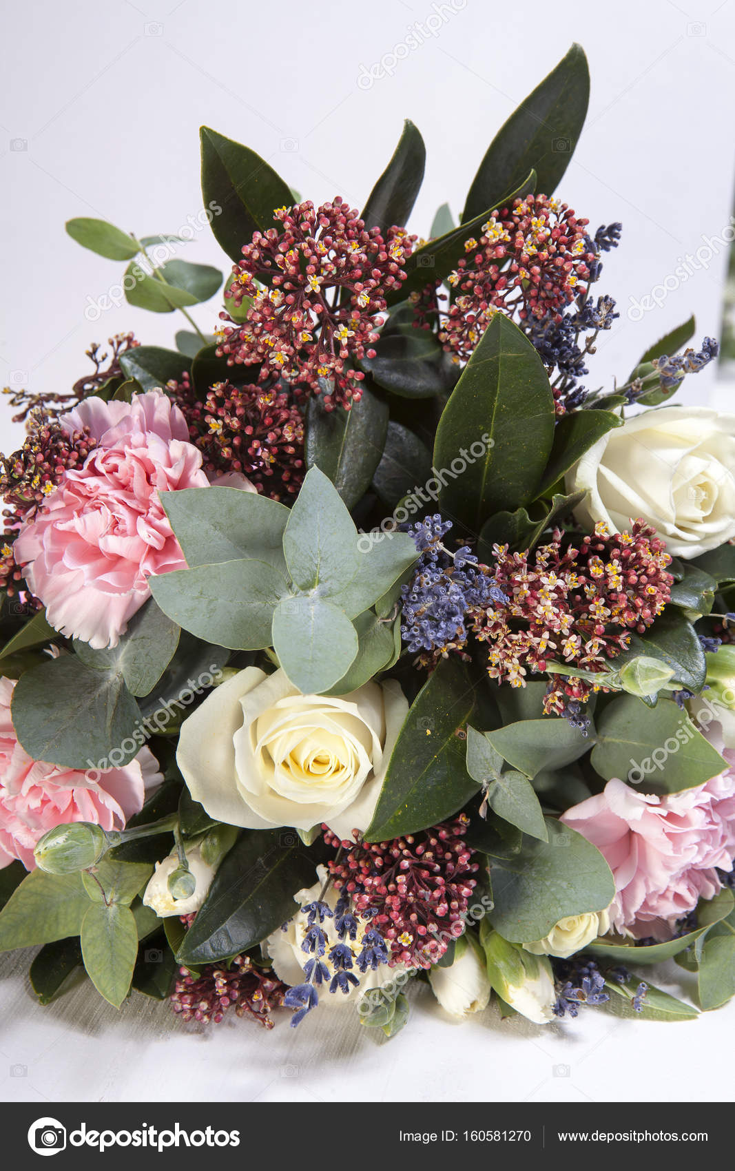 The Wedding bouquet of a bride from a rose, a pink carnation