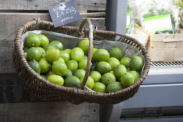 Lime in a wicker box that hangs on the wall, for sale on the market