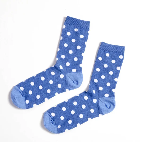 Blue polka dotted socks on white background — Stock Photo, Image