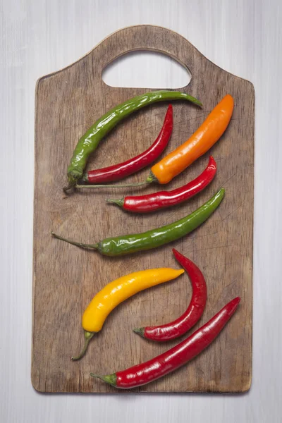 The Hot pepper on cutting board — Stock Photo, Image
