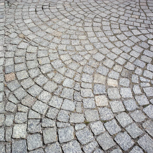 O fragmento de pedra de pavimentação no pavimento em Poznan Polónia — Fotografia de Stock
