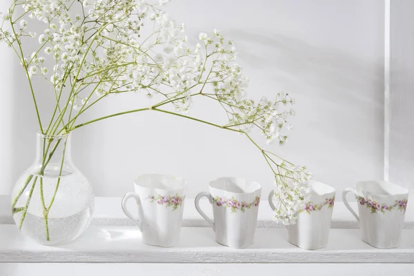 Wedding bouquet in glass vase on a shelf — Stock Photo, Image