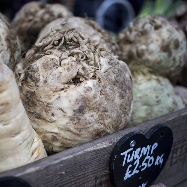 Turnips for sale at counter in Borough Market