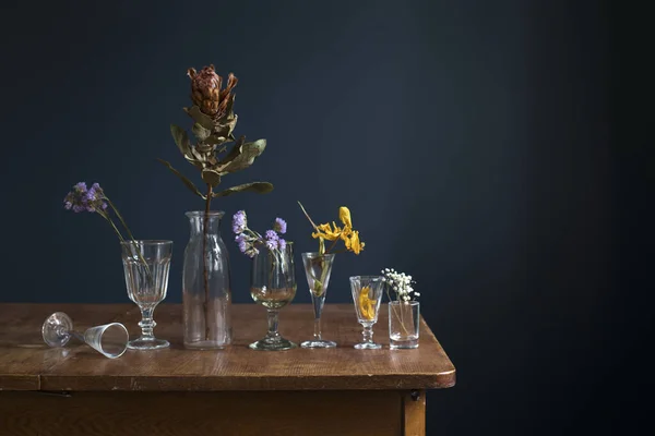 Dried Flowers Glass Glasses Wooden Table Dark Blue Wall Art — Stock Photo, Image