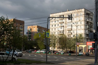 Moscow, Russia - 03 May 2020 , Yuzhnoportovy District. Nine-story buildings of the Brezhnev era - mass housing construction project. Simonov street in front of a thunderstorm with a stormy sky. clipart