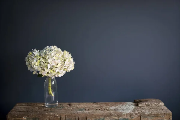 Branch Green Pastel Hydrangea Glass Vase Dark Blue Background Wooden — Stock Photo, Image