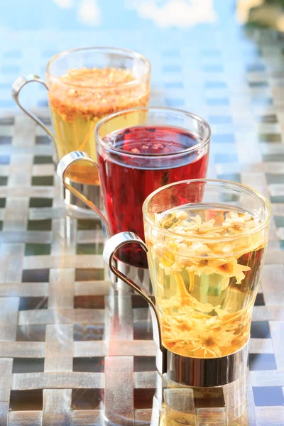 Concept of herbal tea. Variety of herbal teas in glass mugs. Hea