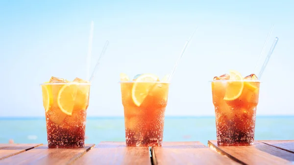 Concept of luxury tropical vacation. Three Cuba Libre cocktails — Stock Photo, Image