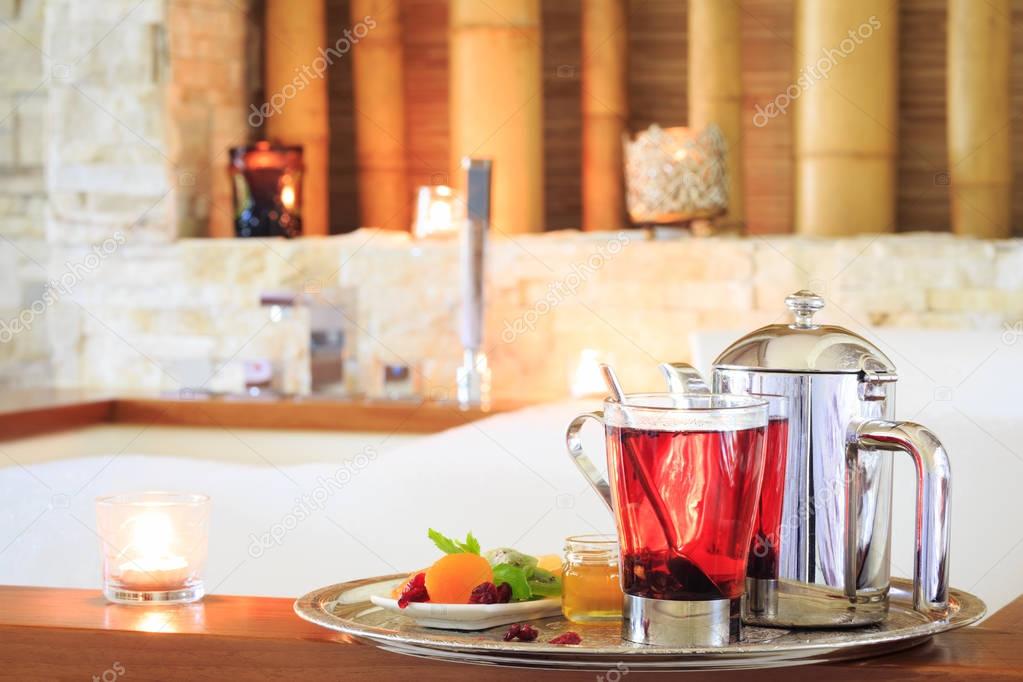 Rosehip tea near jacuzzi. Valentines background. Romance concept