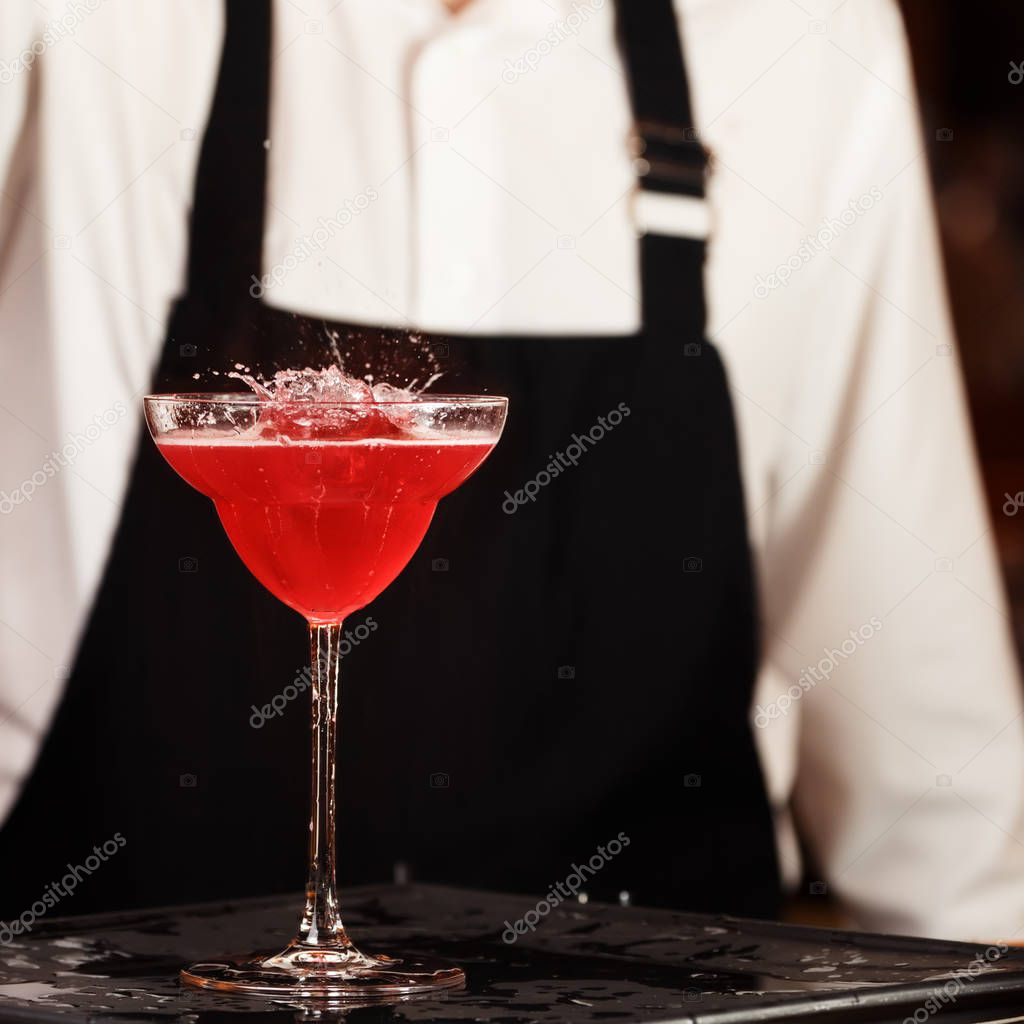 Barman in making cocktail at a nightclub. Nightlife concept. No 