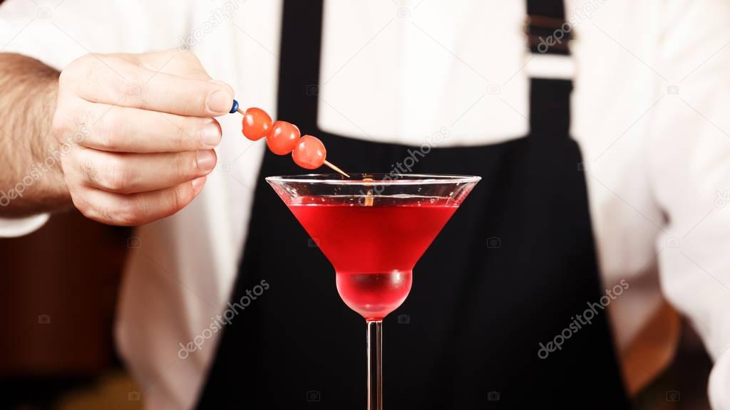 Barman in making cocktail at a nightclub. Nightlife concept. No 
