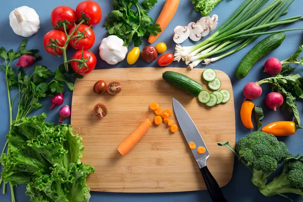 Top view of woman cooking healthy food: cutting vegetable ingred — Stock Photo, Image